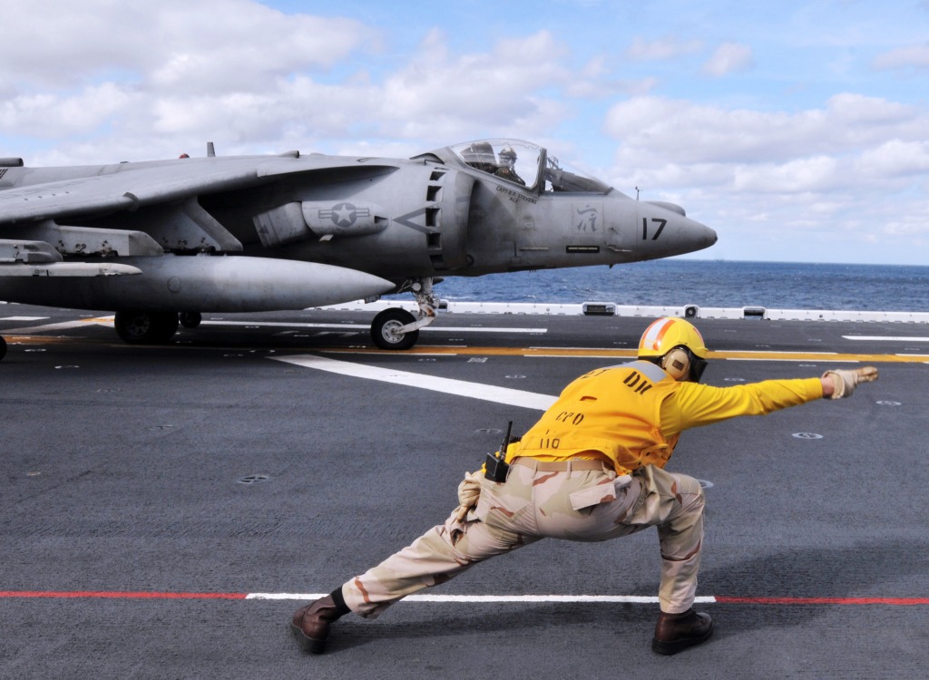 A Sailor Directs an AV-8B Harrier jigsaw puzzle in Aviation puzzles on TheJigsawPuzzles.com