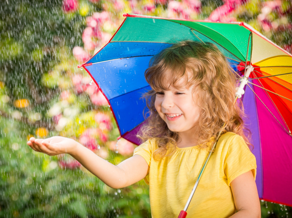Happy Kid in the Rain jigsaw puzzle in Puzzle of the Day puzzles on TheJigsawPuzzles.com