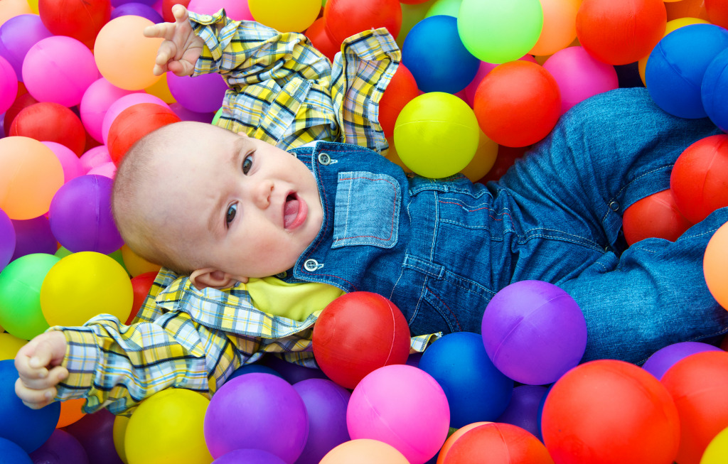 Playing in a Ball Pit jigsaw puzzle in People puzzles on TheJigsawPuzzles.com