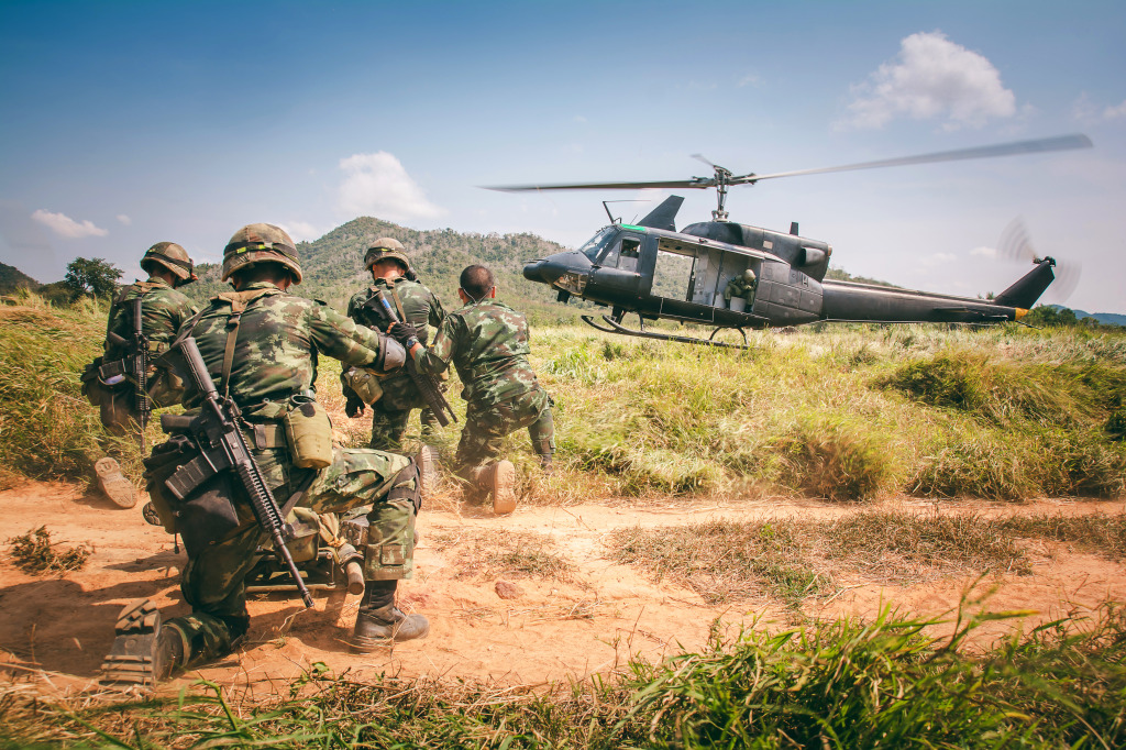 Soldiers Boarding a Military Helicopter jigsaw puzzle in Aviation puzzles on TheJigsawPuzzles.com