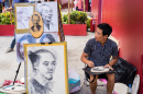 Street Artist in Hochiminh, Vietnam